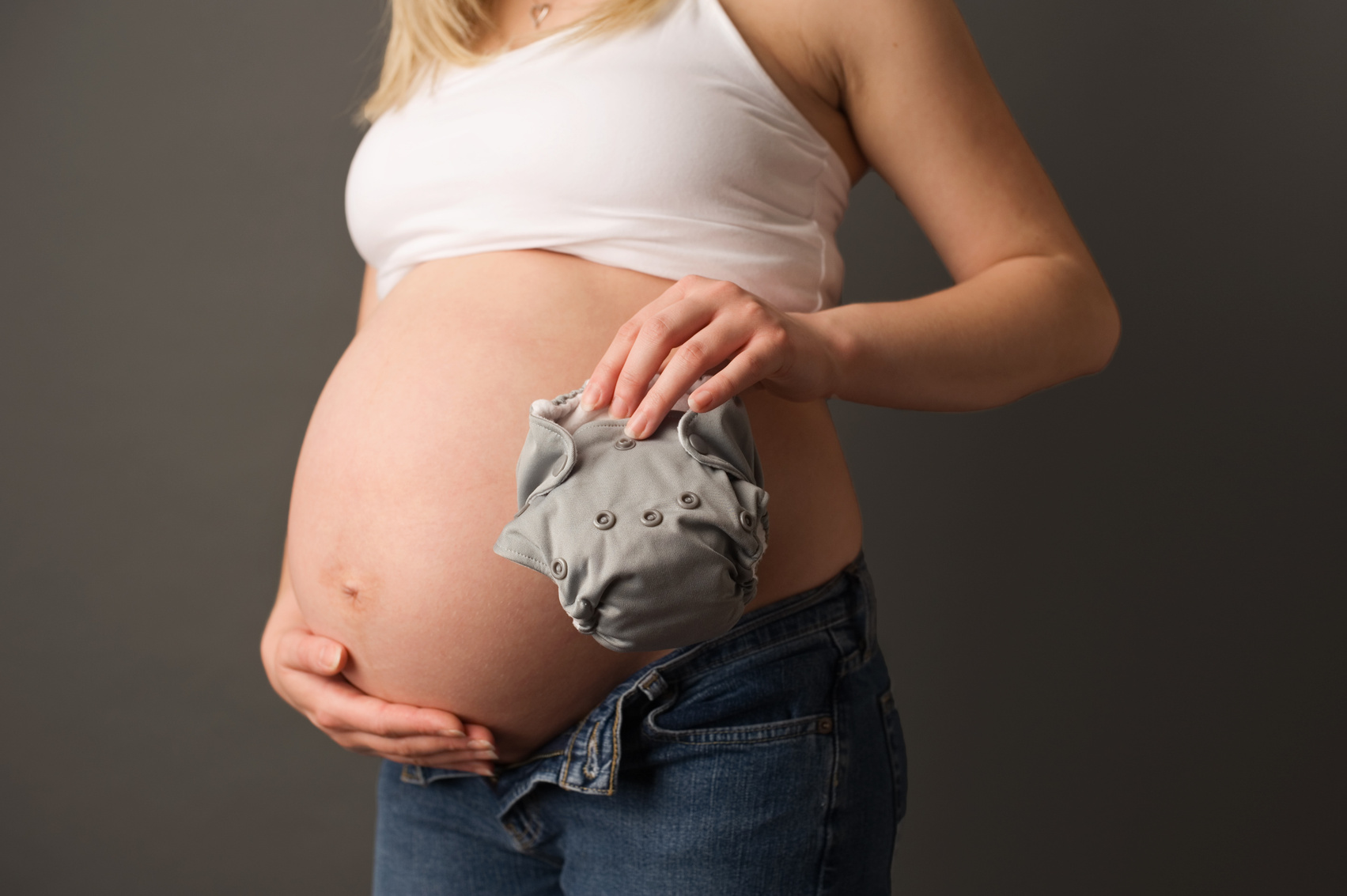 Closeup of Pregnant Woman Holding Cloth Diaper